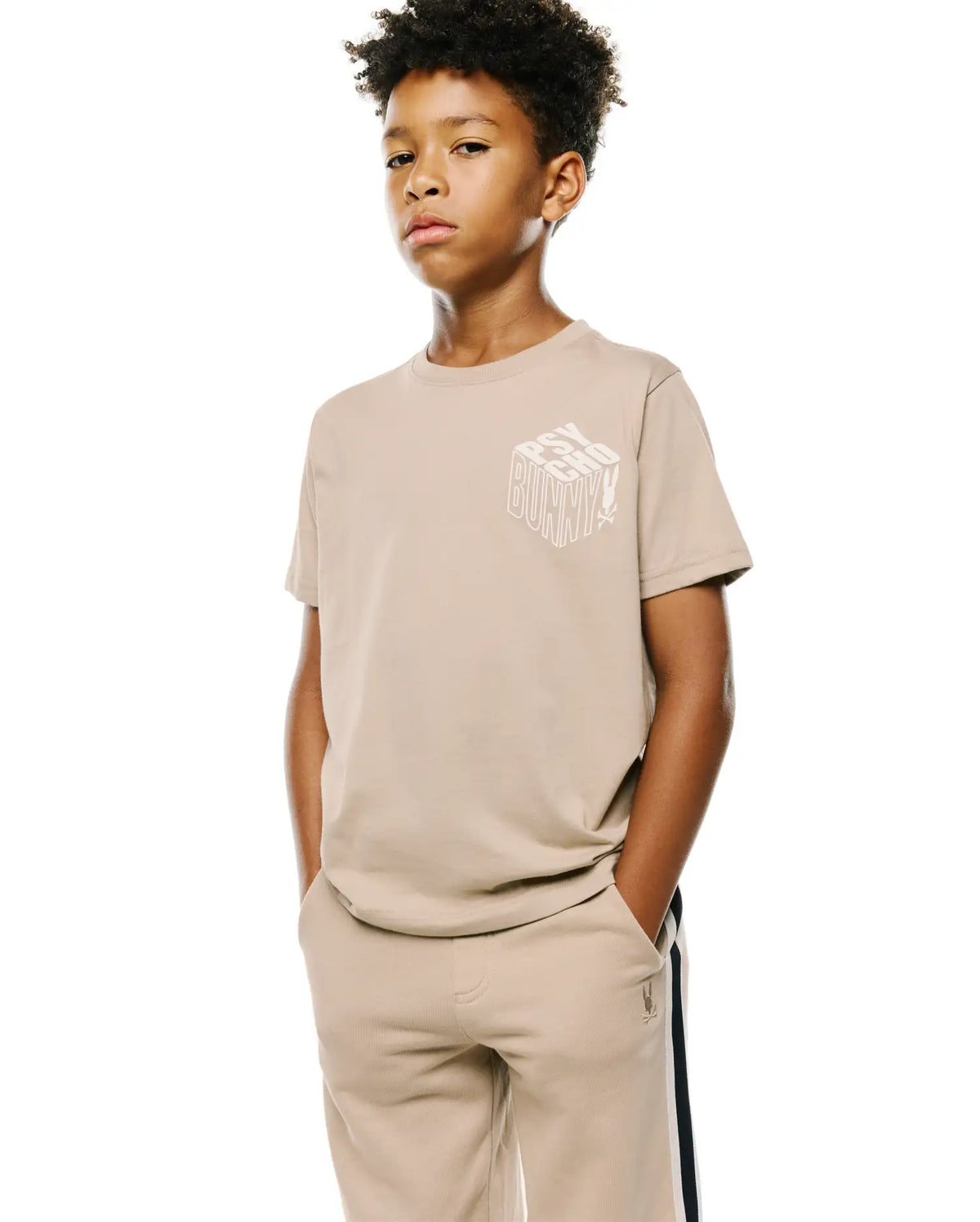 Kids Conan Back Graphic Tee in beige, with a white 3D-effect Psycho Bunny text graphic on the chest, classic fit, smooth jersey fabric. (2)