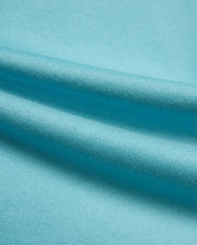 Kid's Norman Longsleeve Oversized Tee in vibrant aqua blue, showcasing its premium, finely woven cotton jersey knit fabric with soft, flowing drapes. (6)