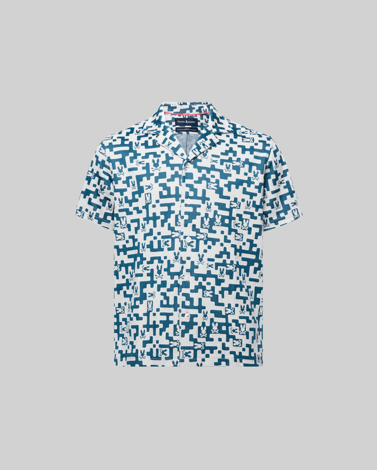 Kids Josh Jacquard Shirt, a white short-sleeve button-up shirt with a teal geometric jacquard pattern featuring integrated small Psycho Bunny skull logos, classic fit.