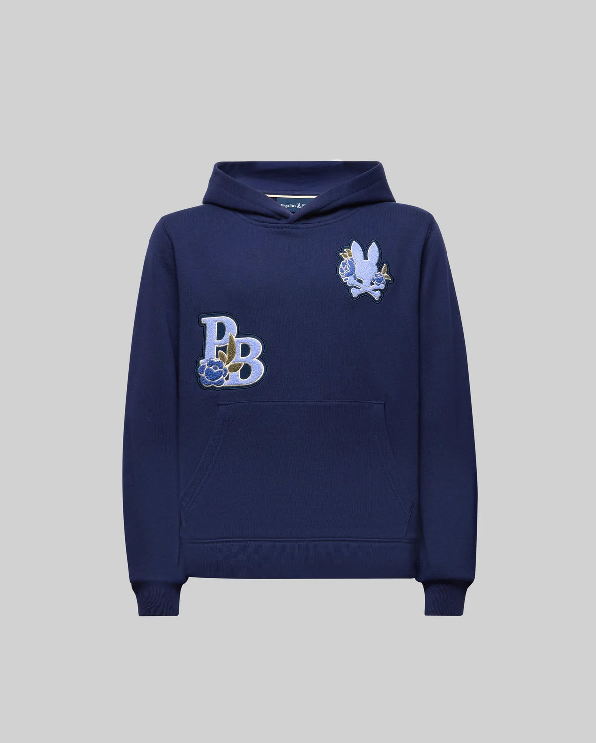 The KIDS AUGUSTE HOODIE - KT0500019 by Psycho Bunny is a navy cotton fleece, regular fit hoodie with a front pocket, "PB" embroidered monogram, and chenille floral detailing on a white-blue rabbit patch on the chest.