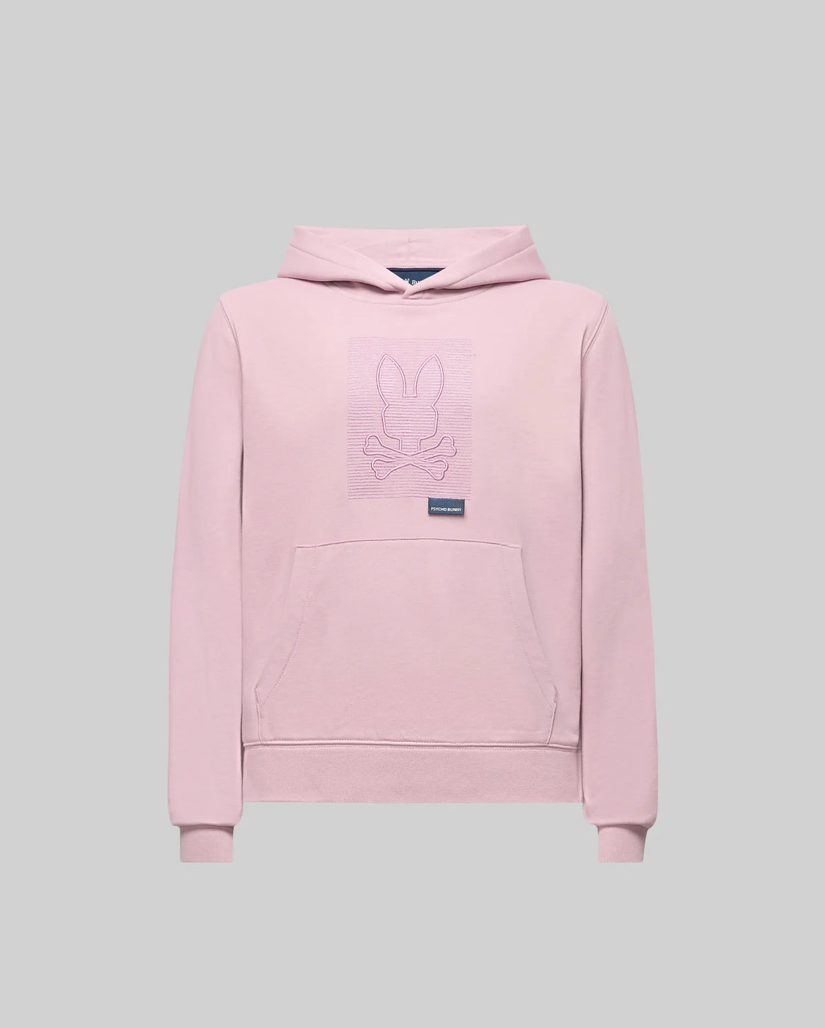 The KIDS GRANT HOODIE - KT0500020 by Psycho Bunny is a light pink premium cotton hoodie with a front pocket and a bunny with crossbones line art on the chest, shown in regular fit against a plain gray background.