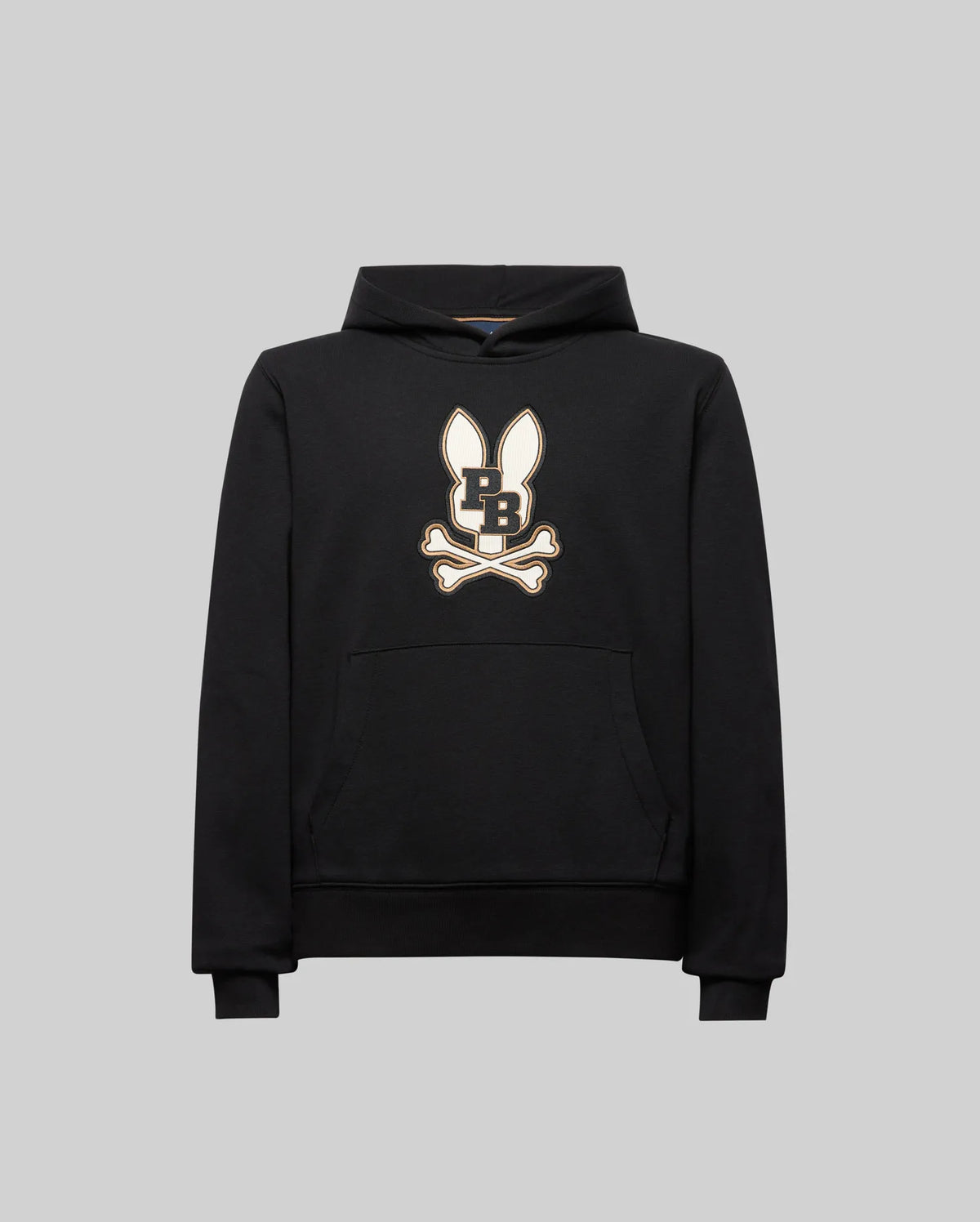 The KIDS WADE CORD PATCH HOODIE (KT0500031) by Psycho Bunny is a black athletic hoodie in a premium cotton blend, with a front pocket and an embroidered Bunny patch on the chest, shown against a plain gray background.