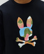 Black classic fit crewneck sweatshirt with a large, central, multi-color embroidered Psycho Bunny skull logo in blue, green, pink, orange, and white. Kids Ara Crew.