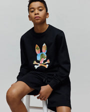 Black Kids Ara Crew relaxed fit french terry sweatshirt with a large multicolor camo embroidered Psycho Bunny skull logo on the chest, paired with black jersey shorts featuring a small tonal embroidered bunny skull on the left leg.