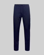 The Psycho Bunny MENS BEN TECH JOGGER PULL ON - MB0600013 features navy blue, soft polyester-spandex jogger pants with a drawstring waist, shown against a plain light gray background.