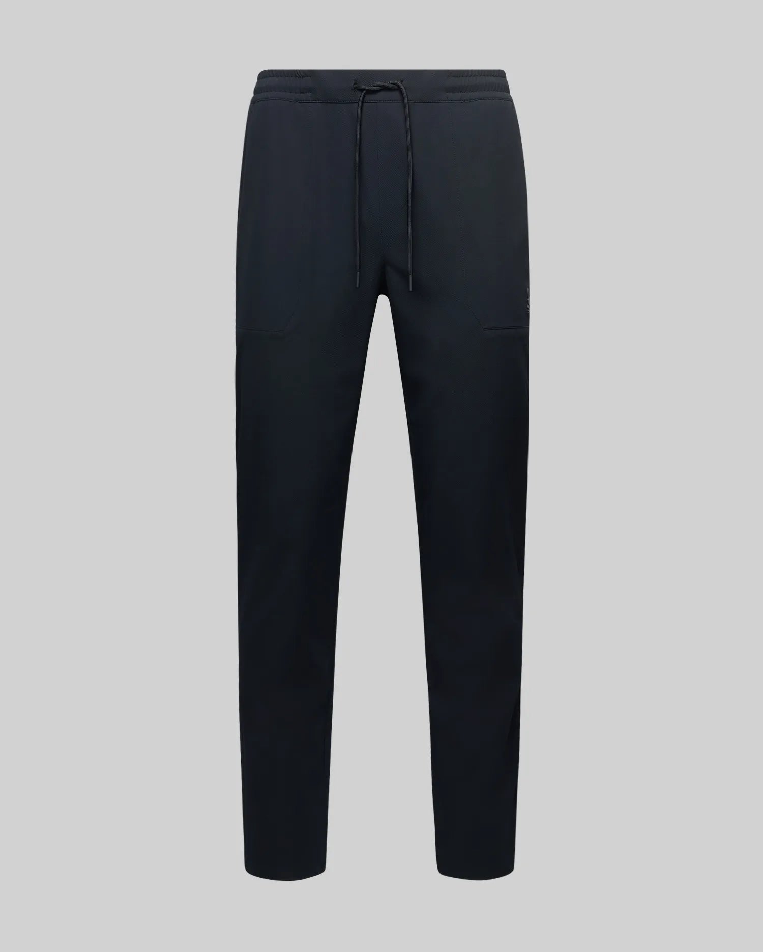 The MENS BEN TECH JOGGER PULL ON - MB0600013 by Psycho Bunny, made from polyester spandex fabric with an elastic waistband, drawstring, and side pockets, is shown against a plain light grey background.