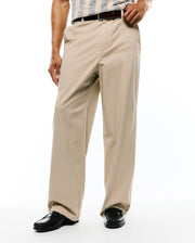 Psycho Bunny Mens Aidan Chino Pant in versatile khaki, a relaxed fit style crafted from smooth cotton twill fabric, featuring a clean flat front and classic straight leg silhouette. (1)