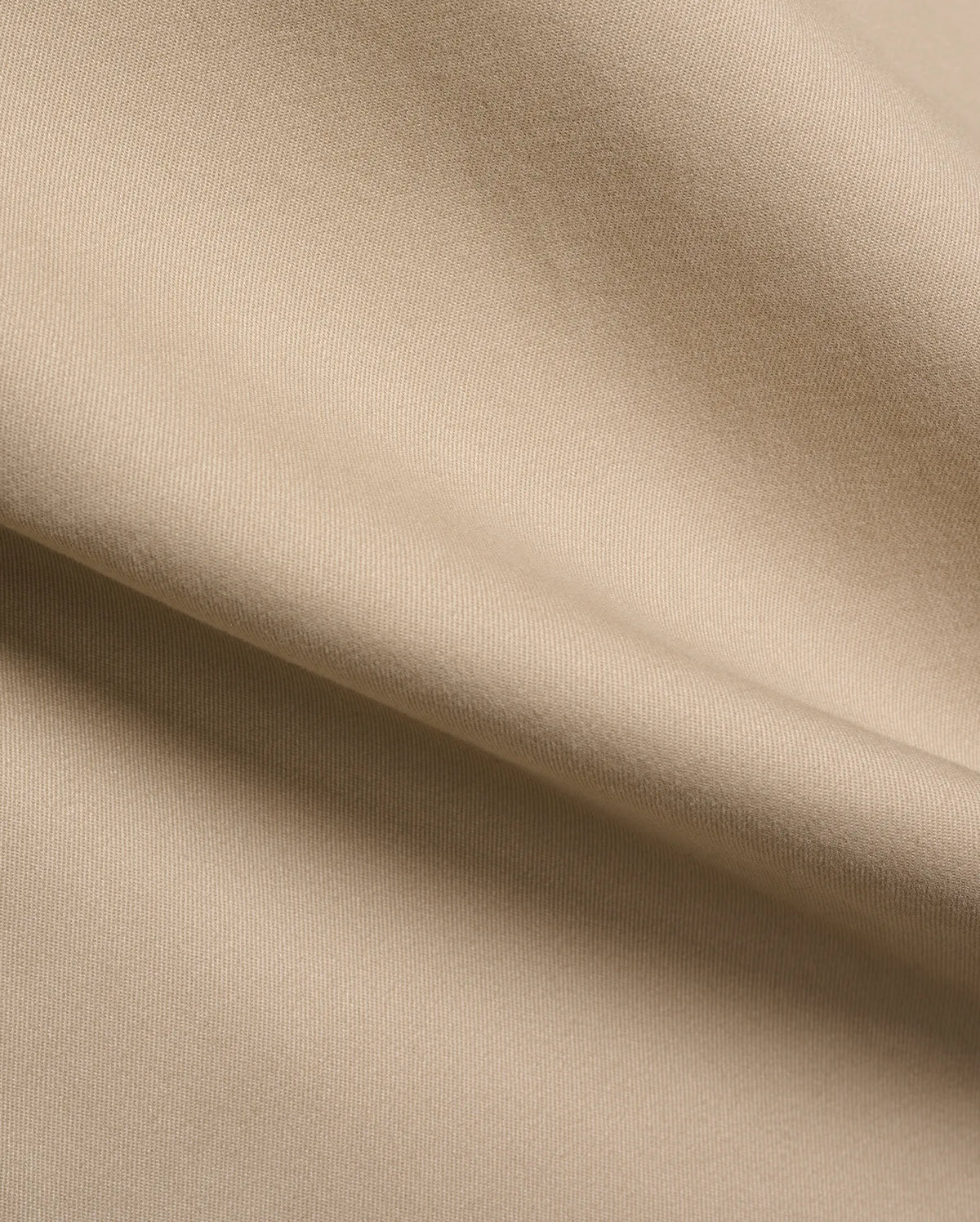 Mens Aidan Chino Pant in a warm khaki beige, featuring a refined, durable twill weave fabric with visible diagonal lines and a smooth, soft texture, draped in gentle folds. (6)