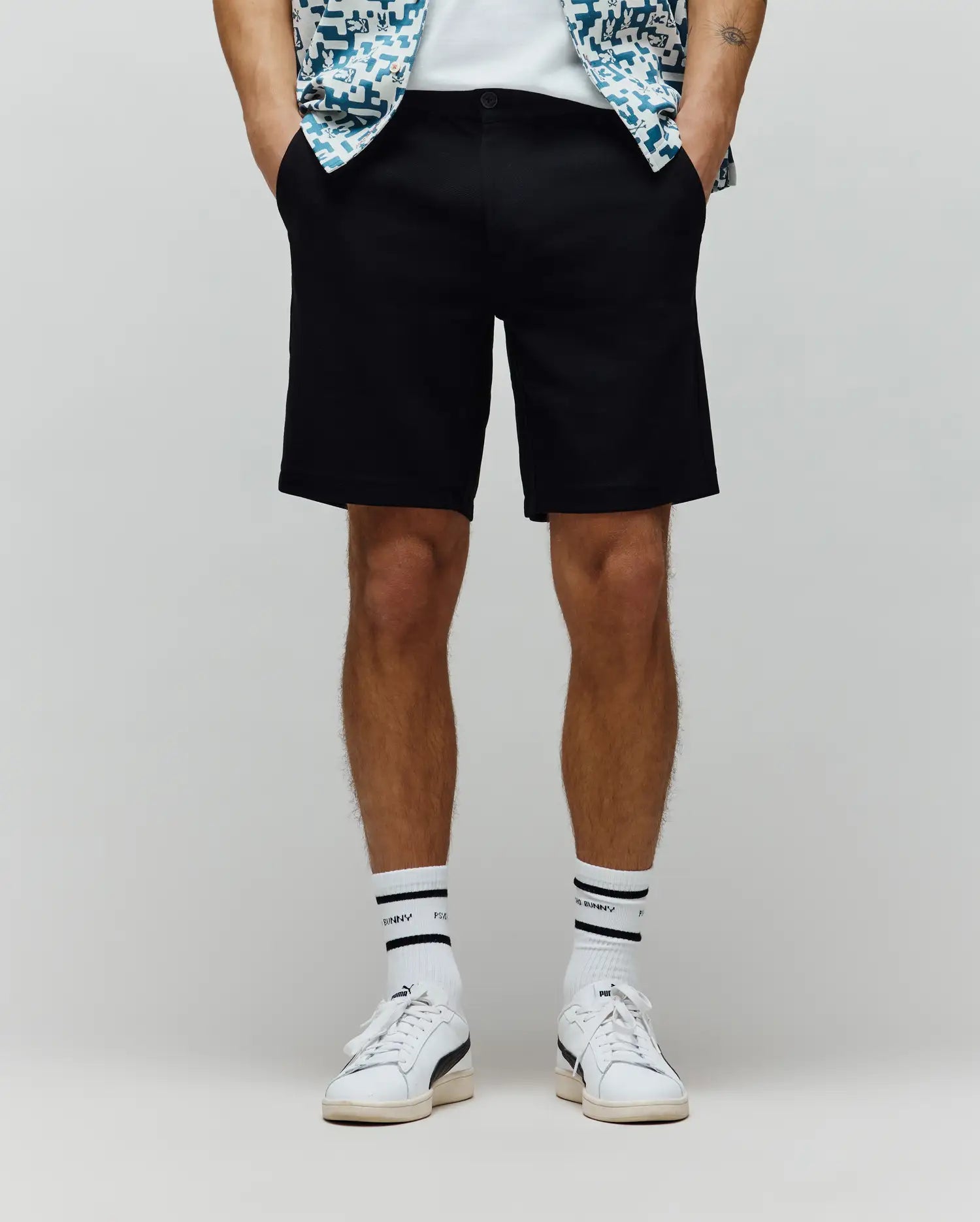 Black Mens Shiro Twill Short, a classic fit flat-front design with convenient side pockets and a refined button closure, made from premium twill fabric.