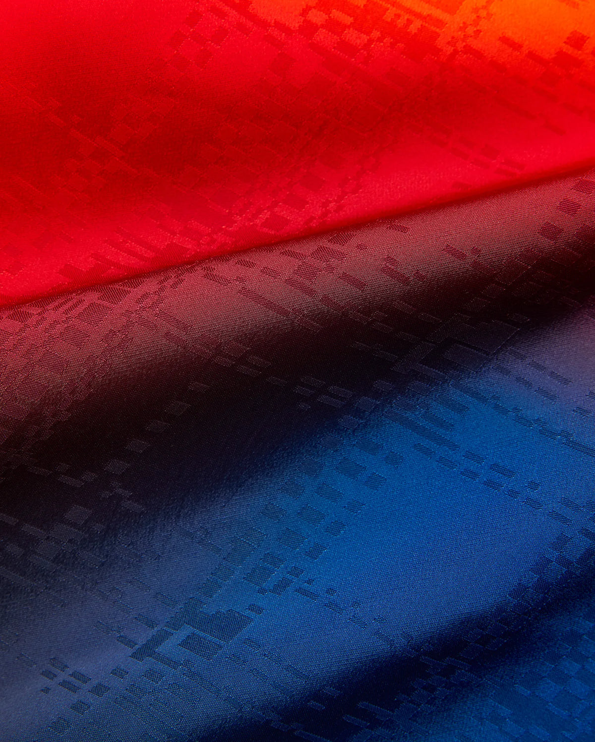 Mens Zander Jacquard Short in a striking red-to-deep-blue gradient, showcasing a refined, all-over tonal geometric jacquard pattern for a premium streetwear aesthetic. (6)