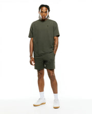 Relaxed fit olive green Mens Arlen Seersucker Short and matching textured T-shirt, both featuring small embroidered black Psycho Bunny skull logos on the left thigh and chest. (4)