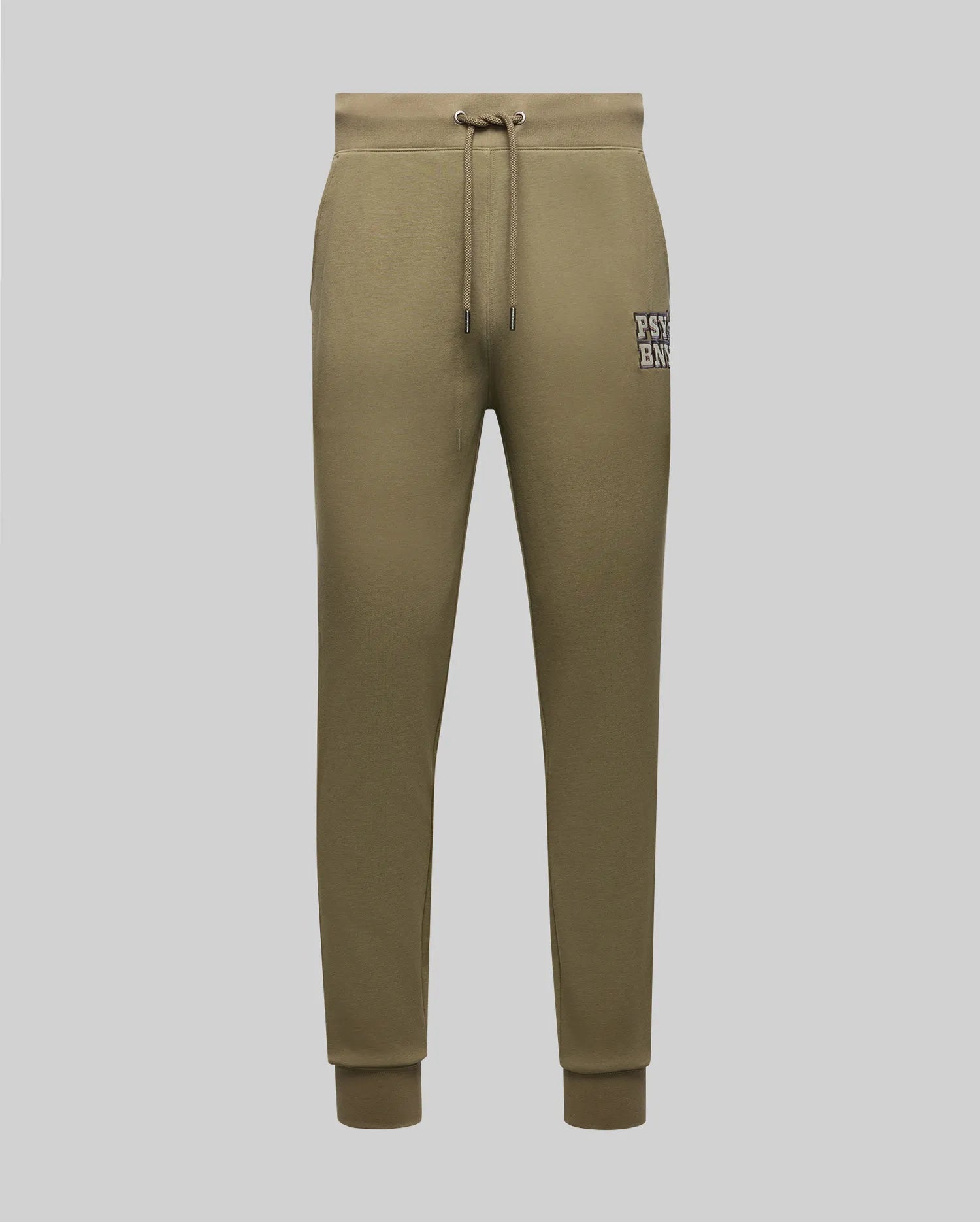 The Psycho Bunny MENS WADE SWEATPANT (MB0800014) features olive green, classic athletic joggers with a premium cotton blend, drawstring waist, ribbed cuffs, side pockets, and a white text patch on the upper left thigh. Shown on a light gray background.