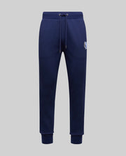The Psycho Bunny MENS AUGUSTE JOGGER - MB0800015 in navy blue is crafted from 100% cotton with a drawstring waist, side pockets, ribbed cuffs, and a small embroidered tiger logo on the left hip, shown on a plain light grey background.