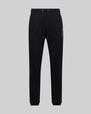 Mens Gage Patch Jogger, black soft jersey with a relaxed fit, featuring a white embroidered Psycho Bunny skull logo on the left thigh and a drawstring waist with ribbed cuffs.