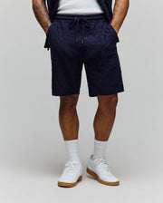Mens Josh Jacquard Knit Short, navy relaxed fit shorts with a subtle all-over jacquard knit pattern of the Psycho Bunny skull logo and a drawstring waist with silver tips.