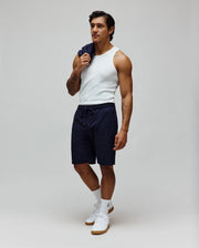 Mens Josh Jacquard Knit Short in navy blue, featuring a relaxed fit, soft jacquard knit fabric with a subtle all-over Psycho Bunny skull logo pattern, and a drawstring waist.