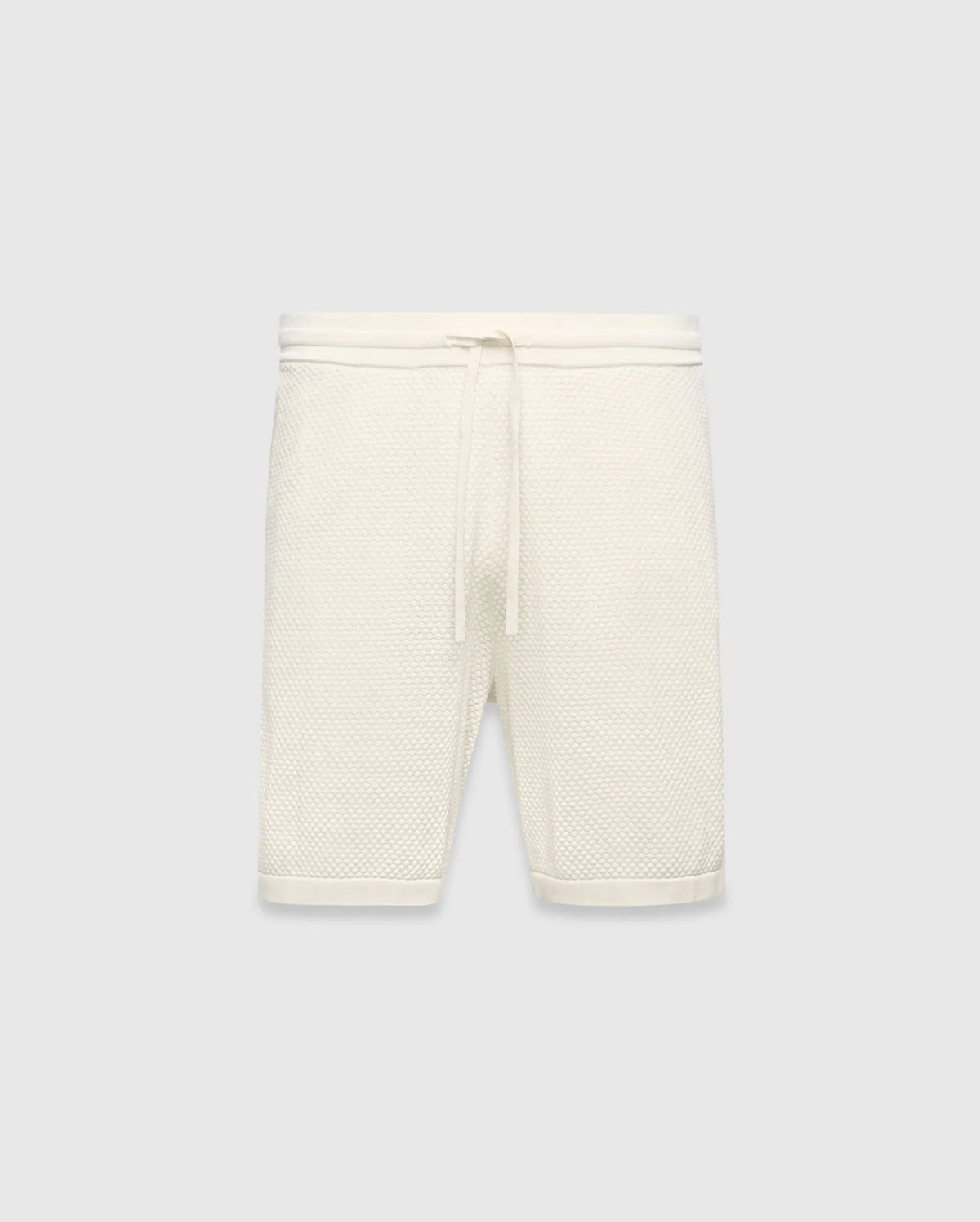 Mens Devon Knit Short in cream, a relaxed fit short crafted from a distinctive textured waffle knit fabric, featuring a ribbed waistband and an adjustable drawstring. (5)