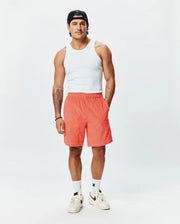 Mens Tristan Short, a premium Psycho Bunny relaxed fit short in vibrant coral, featuring an all-over embossed geometric diamond pattern and practical side pockets. (4)