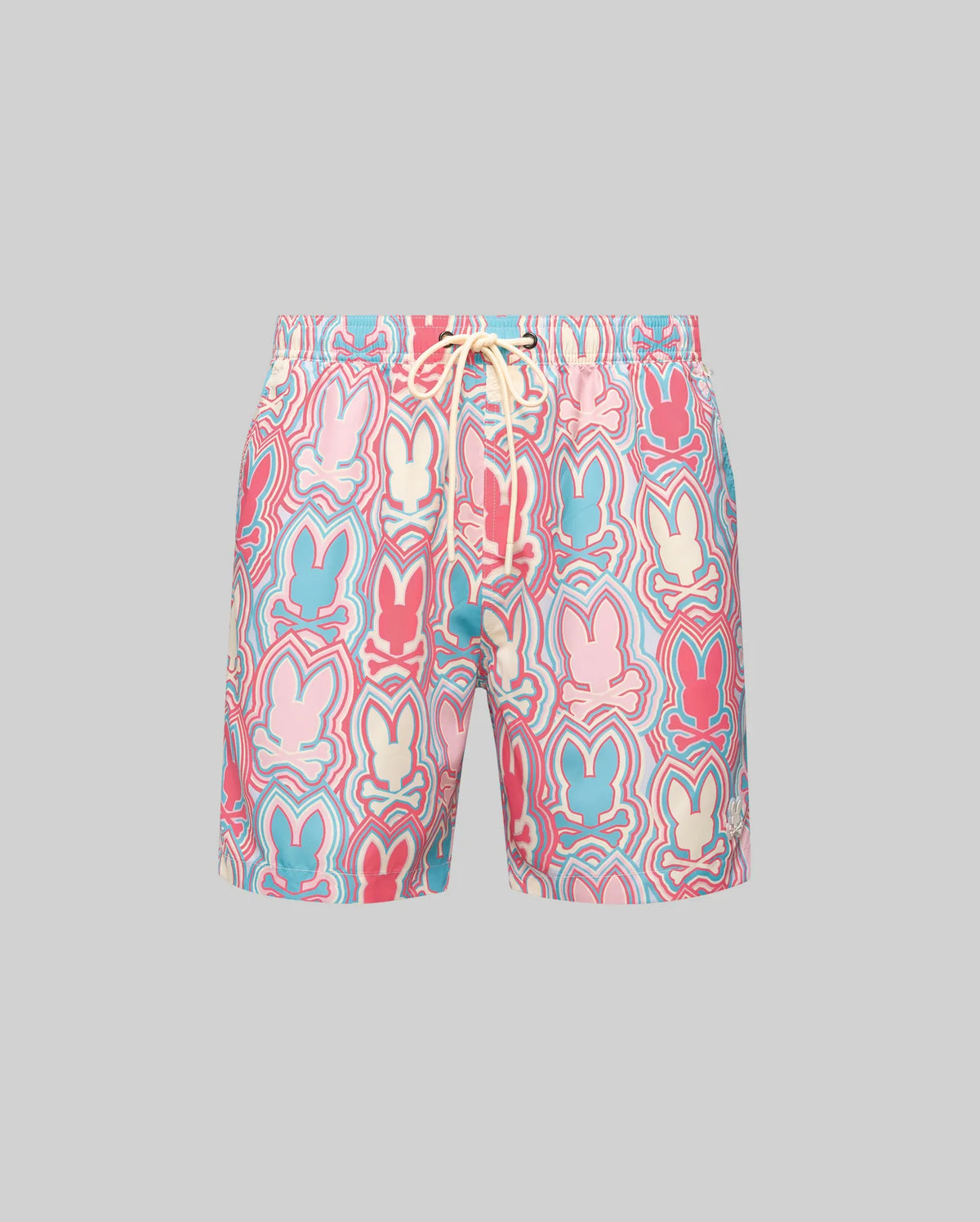 The Psycho Bunny MENS CHUCK ALL OVER PRINT LIGHTWEIGHT SWIM TRUNK - MB1000003 features a colorful bunny silhouette pattern in pink, red, blue, and cream on quick-dry recycled polyester with a drawstring waistband, shown against a gray background.