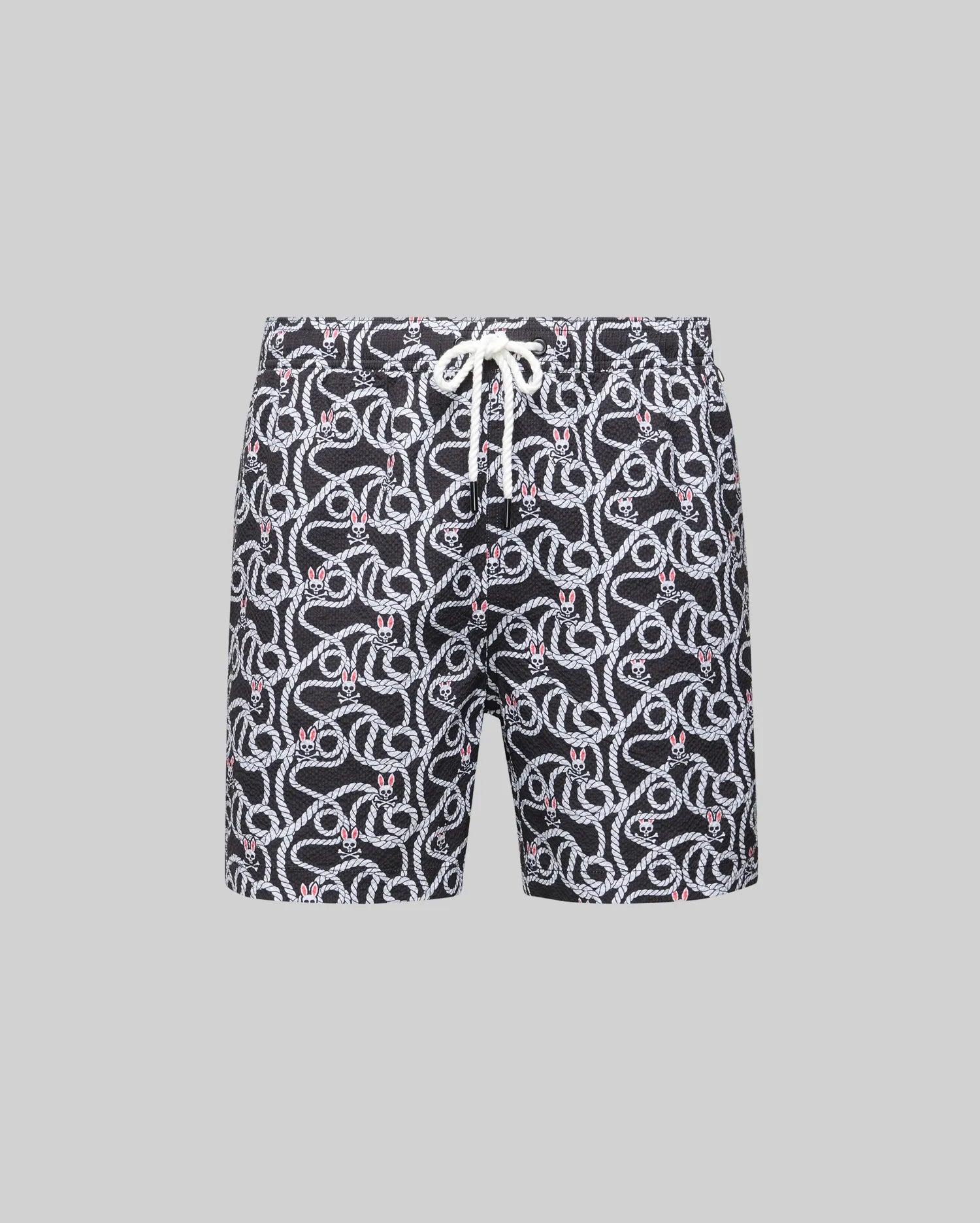 The MENS CYRUS ALL OVER PRINT SWIM TRUNK (MB1000004) by Psycho Bunny features a white and red snake pattern on black quick-dry seersucker, with a white drawstring waist, shown against a plain gray background.