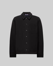 The Psycho Bunny MENS AVEN KNIT SHACKET (MO1100035) is a black button-up knit shacket with a collar, three front pockets, and an embroidered cartoon bunny face on the left chest pocket, shown on a plain gray background.