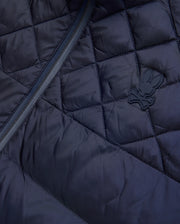 Mens Emerik Puffer Jacket, a navy quilted puffer jacket crafted from smooth nylon, featuring a dark zipper and a small, rubberized Psycho Bunny skull logo on the chest. (6)