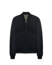 Mens Joaquin Mix Media Reversible Bomber in black with large tonal PSYCHO BUNNY chest text, full zip with skull logo pull, ribbed trim, and olive green quilted reverse side. (7)