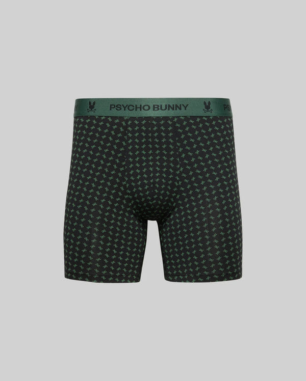 The MENS SINGLE BOXER BRIEF - MO1400010 by Psycho Bunny features black breathable Pima cotton, a green Psycho Bunny waistband, and a small green bunny pattern, shown on a plain grey background for all-day comfort.
