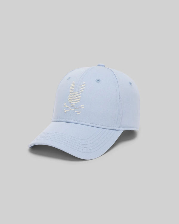 The Psycho Bunny MENS GRANT BASEBALL CAP - MO1500﻿037 is a light blue cotton cap with a curved brim, white embroidered running rabbit logo on the front, adjustable backstrap, shown on a plain grey background.