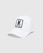 White Mens Adamo Trucker Cap featuring a large, centered black embroidered Psycho Bunny skull and crossbones logo patch with PSYCHO BUNNY text on the solid front panel and a breathable mesh back. (2)