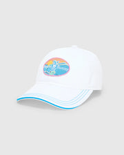 Mens Ray Baseball Cap in white with a blue-trimmed brim and matching stitching. Features a large, colorful embroidered oval patch on the front with the Psycho Bunny skull logo, sun, and waves in pink, yellow, and teal. (2)