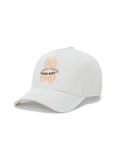 Mens Alex A-Frame Trucker Cap in white, featuring a large orange outlined bunny skull logo with black Psycho Bunny text on the front, and repeated orange Psycho Bunny text on the brim. (2)