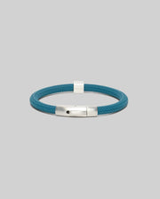 Mens Silicone Bracelet in vibrant teal, featuring a distinctive textured chevron pattern and a polished silver-toned metal clasp, a modern refined streetwear accessory.