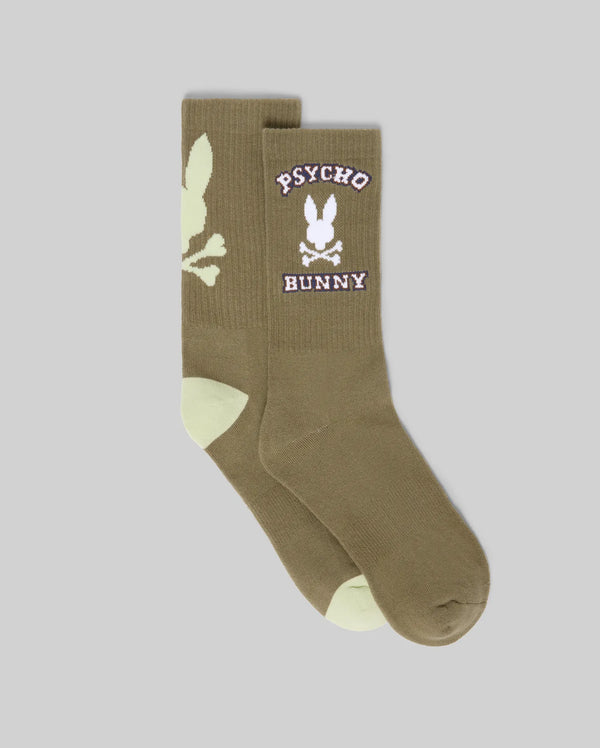 Psycho Bunny MENS 2PK BUNNY SPORT SOCK (MO2200038) features olive green socks with light green toe and heel, a white skull and bunny logo, "Psycho Bunny" text in white/pink on the sides, crafted from soft Pima cotton.