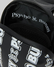 Mens Rubberized Crossbody in black, featuring a prominent white repeating Psycho Bunny skull logo and text pattern on its smooth exterior, complemented by a black interior lining with white Psycho Bunny branding.