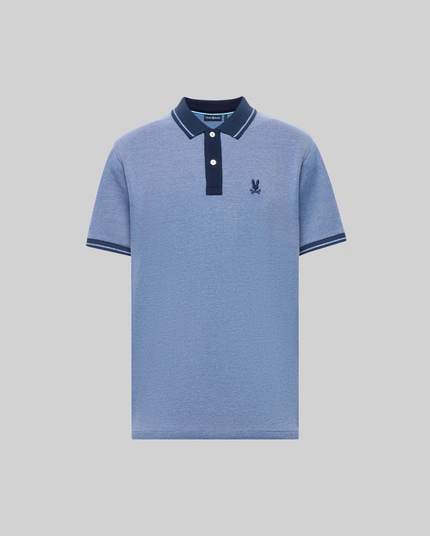 The Psycho Bunny QUINTON TEXTURE PIQUE POLO features light blue short sleeves, a dark blue collar and button placket with white buttons, dark blue sleeve trim, and a dark blue embroidered logo on the left chest.
