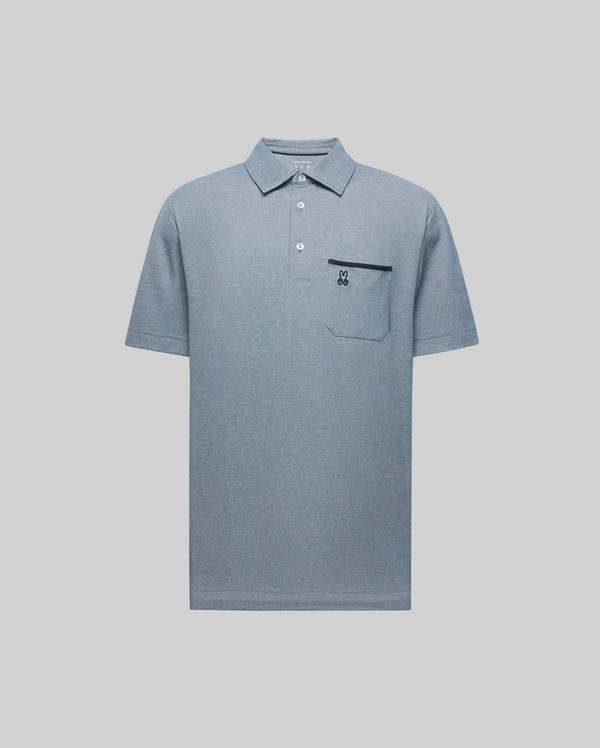 The Psycho Bunny MENS HADLEY PERFORMANCE PIQUE POLO (MT0100021) is a light blue short-sleeve polo with a collar, three buttons, chest pocket, and small embroidered bunny logo. Displayed against a plain light background.