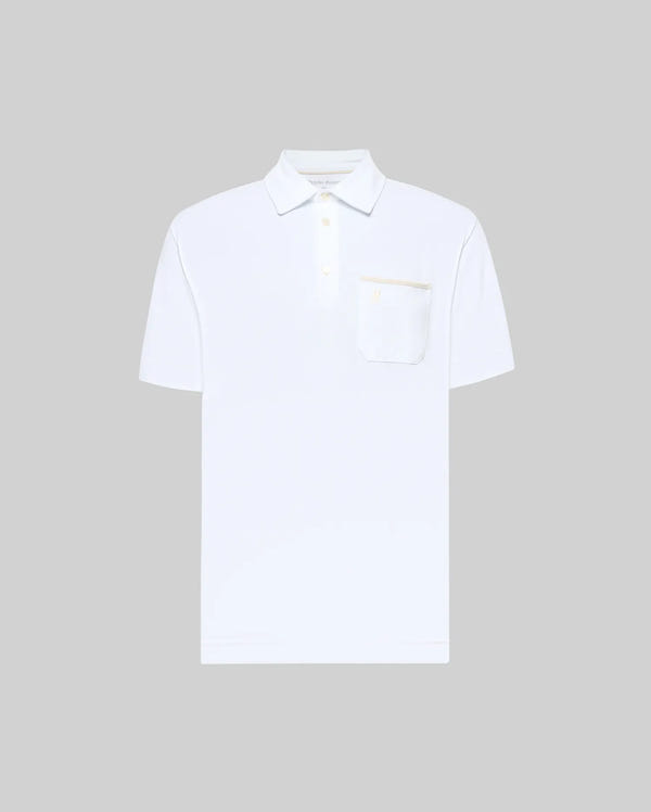 The Psycho Bunny MENS HADLEY PERFORMANCE PIQUE POLO (MT0100021) is a plain white, short-sleeve polo with a collar, three buttons, and a chest pocket, shown on a light gray background.