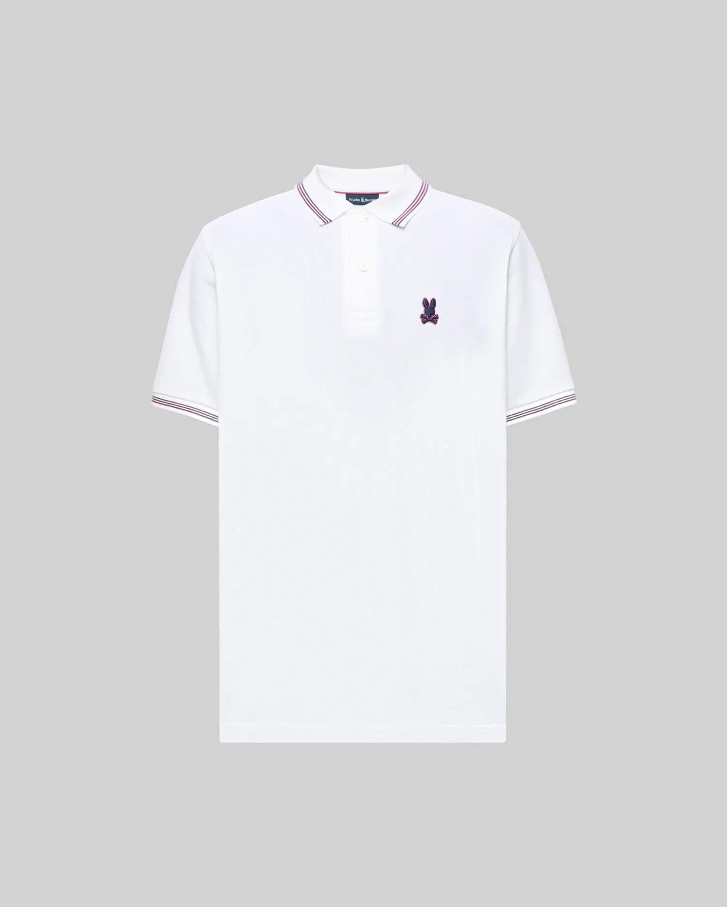 The Psycho Bunny MENS HART PIQUE POLO SHIRT (MT0100032) is a white Pima cotton polo with purple collar and sleeve trim, buttoned placket, and a small purple bunny logo on the chest, shown on a gray background.