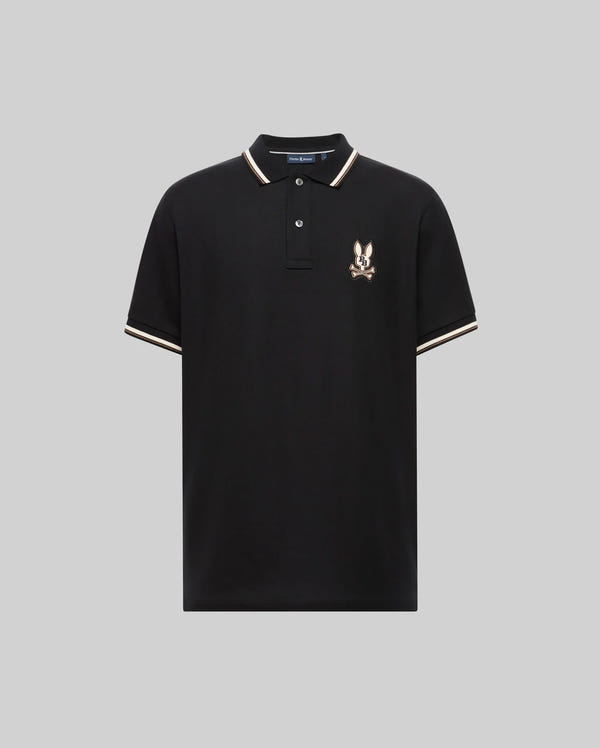 The Psycho Bunny MENS WADE PIQUE POLO SHIRT - MT0100044 is a black Pima cotton polo with white and beige colorblock tipping, two buttons, and an embroidered bird crest on the left chest.