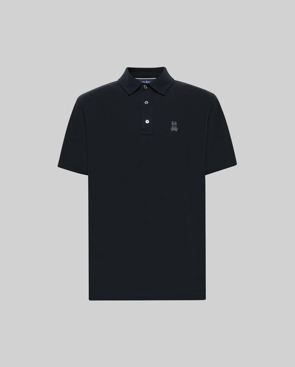 The Psycho Bunny MENS PHOENIX FASHION POLO - MT0100096 is a black short-sleeve Pima cotton knit shirt with a collar, two white buttons, and an embroidered logo on the left chest, shown on a plain light gray background.
