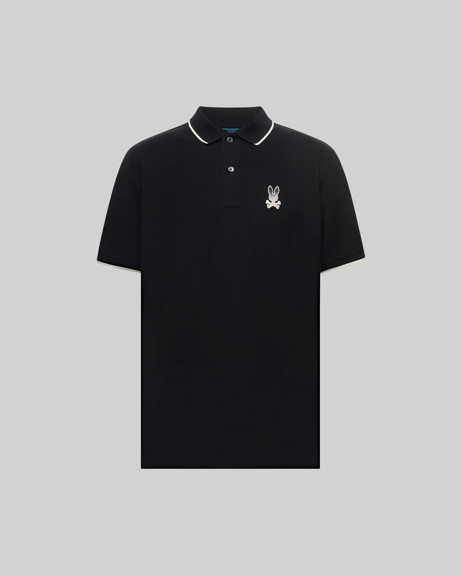 Mens Aram Pique Polo, black classic fit polo with white tipping on collar and cuffs, featuring a silver embroidered Psycho Bunny skull logo on the left chest and two black buttons.