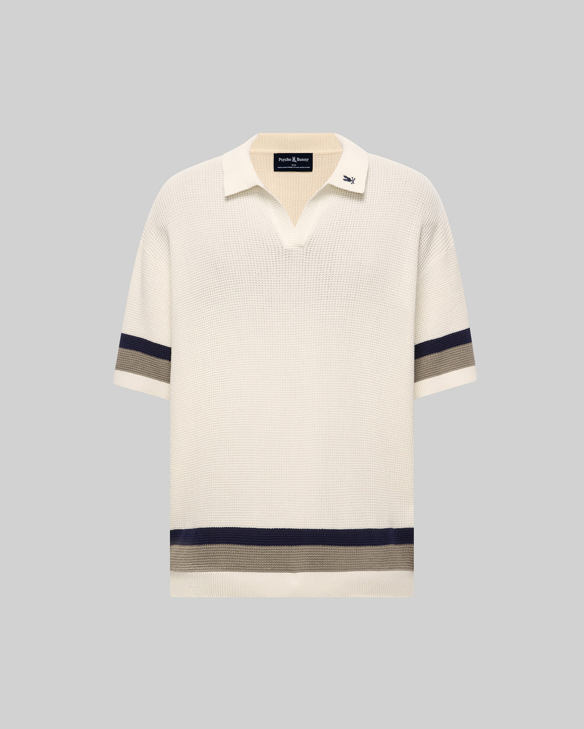 Mens Lochlan Oversized Johnny Collar Polo in cream waffle knit, featuring navy and grey stripes on the short sleeves and hem, with a small embroidered Psycho Bunny skull logo on the collar.