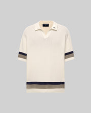 Mens Lochlan Oversized Johnny Collar Polo in cream waffle knit, featuring navy and grey stripes on the short sleeves and hem, with a small embroidered Psycho Bunny skull logo on the collar.