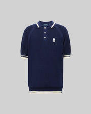 The Psycho Bunny MENS LAZARE KNIT POLO (MT0100165) is a navy short-sleeve textured knit with white trim on the collar, cuffs, and hem, a white embroidered bunny logo on the left chest, and a classic three-button placket.