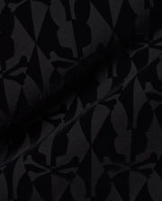 Men's Angus Flocked Polo featuring a tonal black flocked Psycho Bunny skull and crossbones and diamond pattern on a black pique knit fabric. (6)