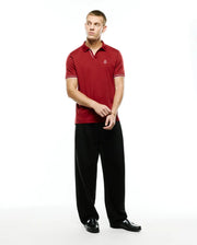Men's Nasser Johnny Collar Polo in rich red pique, featuring a classic fit, white tipped Johnny collar, ribbed cuffs with white stripes, and a small embroidered Psycho Bunny skull logo on the left chest. (4)