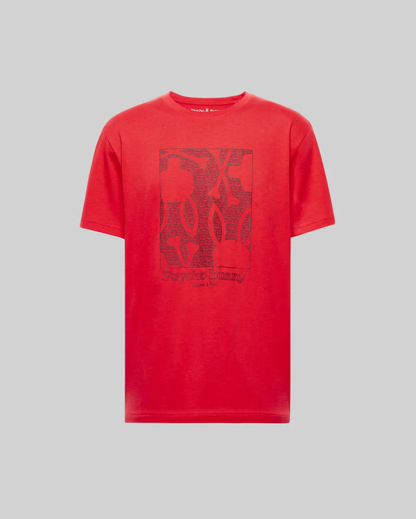 The MENS GLENN GRAPHIC TEE - MT0200034 by Psycho Bunny is crafted from 100% Pima cotton in red, and features a bold Bunny graphic with "Psycho Bunny" text on the front, shown on a plain gray background.