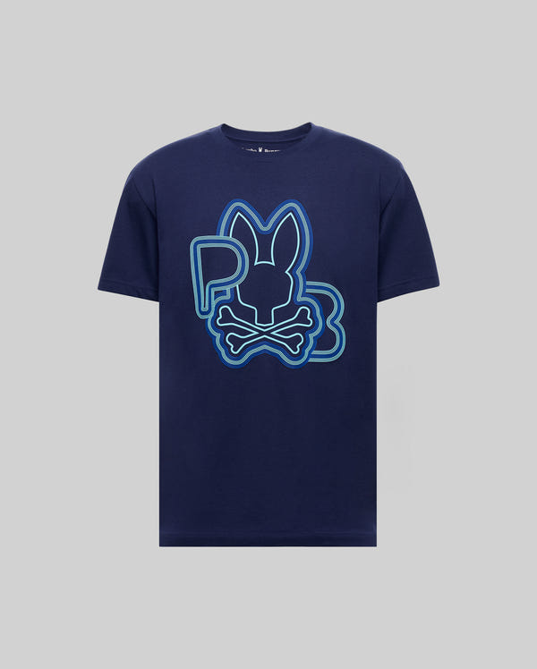 The MENS CARLO GRAPHIC TEE - MT0200049 by Psycho Bunny features a navy blue design with a large bunny head above crossbones, outlined in blue and green, and "P B" letters on the chest.