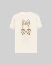 The Psycho Bunny MENS NICHOLAS EMBROIDERED TEE (MT0200054) features a cream base with a beige and brown embroidered bunny head and crossed bones motif centered on the chest.